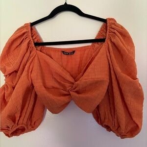 Puffy orange mid sleeve top